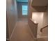 Upstairs hallway with neutral carpet and window at 503 Bendemeer Ln, Rolesville, NC 27571