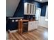 Modern wet bar with wine cooler and wood countertop at 503 Bendemeer Ln, Rolesville, NC 27571