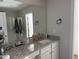 Bathroom with granite vanity, large mirror, and shower at 5200 Stream Stone Way, Raleigh, NC 27616