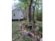 Charming backyard with flowerbeds, lush greenery, and American flag at 540 Patterson Dr, Chapel Hill, NC 27516
