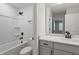 Modern bathroom featuring a shower-tub combo and vanity with contemporary fixtures and white countertops at 55 New Liberty Dr, Youngsville, NC 27596