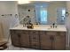 Bathroom with double vanity, granite countertops, and large mirror; a luxurious and functional space at 55 New Liberty Dr, Youngsville, NC 27596
