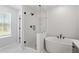 Elegant bathroom with glass shower and soaking tub at 55 New Liberty Dr, Youngsville, NC 27596