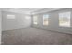 Large bedroom with neutral carpet and windows at 55 New Liberty Dr, Youngsville, NC 27596