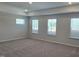 Spacious bedroom with neutral carpet, recessed lighting, and multiple windows offering natural light at 55 New Liberty Dr, Youngsville, NC 27596