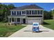 Beautiful new construction home featuring a brick and siding exterior, inviting front porch, and attached two-car garage at 55 New Liberty Dr, Youngsville, NC 27596