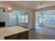 Open-concept floor plan featuring a cozy living room with fireplace next to the kitchen and lots of natural light at 55 New Liberty Dr, Youngsville, NC 27596