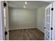 Bright office features French doors, recessed lighting, and wood-look flooring at 55 New Liberty Dr, Youngsville, NC 27596