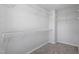 Walk-in closet with ample storage space and carpeted floors at 55 New Liberty Dr, Youngsville, NC 27596
