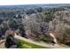 House nestled in a wooded community near a lake at 6701 Green Hollow Ct, Wake Forest, NC 27587