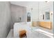 Modern bathroom featuring a soaking tub, glass shower with gold hardware, and a custom vanity at 6701 Green Hollow Ct, Wake Forest, NC 27587