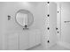 Modern bathroom with white cabinets, black hardware, and modern mirror at 6701 Green Hollow Ct, Wake Forest, NC 27587