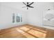 Large primary bedroom with hardwood floors, lots of natural light, and an ensuite bathroom at 6701 Green Hollow Ct, Wake Forest, NC 27587