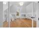 Cozy bedroom with hardwood floors, natural light, and a charming play area at 6701 Green Hollow Ct, Wake Forest, NC 27587