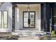 Modern double front door with glass panels and black frame at 6701 Green Hollow Ct, Wake Forest, NC 27587