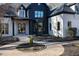 Elegant front entrance with a stone walkway and modern black and white design at 6701 Green Hollow Ct, Wake Forest, NC 27587