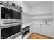 Gourmet kitchen featuring stainless steel appliances and custom cabinetry at 6701 Green Hollow Ct, Wake Forest, NC 27587