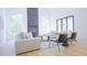 Modern living room features floor-to-ceiling fireplace, neutral palette and ample light at 6701 Green Hollow Ct, Wake Forest, NC 27587