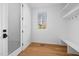 Bright mudroom with hardwood floors, storage, and a window offering natural light at 6701 Green Hollow Ct, Wake Forest, NC 27587