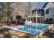 Luxury backyard oasis featuring a rectangular pool and spacious deck at 6701 Green Hollow Ct, Wake Forest, NC 27587