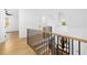 Open staircase with wood treads, iron railings, and lots of natural light at 6701 Green Hollow Ct, Wake Forest, NC 27587