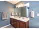 Double vanity bathroom with a large mirror and plenty of storage at 6817 Osprey Landing Dr, Wendell, NC 27591