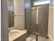 Modern bathroom with glass-enclosed shower and vanity at 85 Kissington Way, Benson, NC 27504