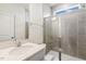 Modern bathroom featuring a walk-in shower, granite counter tops, and a white vanity at 85 Kissington Way, Benson, NC 27504