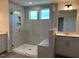 Bathroom featuring dual vanities, a spacious shower, and modern fixtures at 85 Kissington Way, Benson, NC 27504