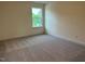 Comfortable bedroom with neutral carpet and a window with natural light at 85 Kissington Way, Benson, NC 27504