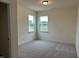 Comfortable carpeted bedroom with double windows at 85 Kissington Way, Benson, NC 27504