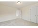 Empty bedroom features a light with carpet floors and an open closet door at 85 Kissington Way, Benson, NC 27504