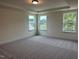Spacious main bedroom with multiple windows and plush carpet floors at 85 Kissington Way, Benson, NC 27504