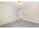 Bright bedroom features neutral walls, plush gray carpet, and access to another room, offering flexible living at 85 Kissington Way, Benson, NC 27504