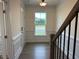 Entryway with large window that provides natural light, complemented by wainscoting at 85 Kissington Way, Benson, NC 27504