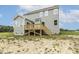 Exterior shot of home with porch, blue siding, green lawn, and blue sky at 85 Kissington Way, Benson, NC 27504