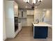 Spacious kitchen featuring an island, white cabinets, stainless appliances, and open floorplan at 85 Kissington Way, Benson, NC 27504