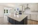 Open kitchen with large island that connects to another room at 85 Kissington Way, Benson, NC 27504
