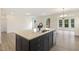 View of kitchen island in an open concept living area at 85 Kissington Way, Benson, NC 27504