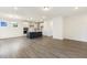 Expansive living area featuring hardwood floors and an island kitchen with stainless steel appliances at 85 Kissington Way, Benson, NC 27504