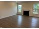 Bright living room with fireplace and three large windows with natural light at 85 Kissington Way, Benson, NC 27504