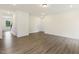 Spacious living room featuring hardwood floors, crown molding, and multiple entryways for easy flow at 85 Kissington Way, Benson, NC 27504