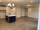 Open-concept living space featuring island, recessed lighting, and hardwood flooring at 85 Kissington Way, Benson, NC 27504