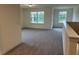 Loft area with soft carpeting and natural light from windows at 85 Kissington Way, Benson, NC 27504
