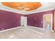 Spacious bedroom with carpet, multiple windows, and doors at 105 Kingfisher Way, Louisburg, NC 27549