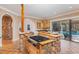Kitchen with gas stove, island, and pool view at 105 Kingfisher Way, Louisburg, NC 27549