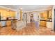 Open kitchen boasting an island and a view of the pool at 105 Kingfisher Way, Louisburg, NC 27549