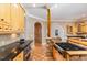 Kitchen with granite countertops and wood cabinets at 105 Kingfisher Way, Louisburg, NC 27549