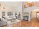 Spacious living room with high ceilings and tile floors at 105 Kingfisher Way, Louisburg, NC 27549