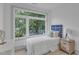 Bright bedroom with a large window overlooking a beautiful tree at 1105 Glascock St # 102, Raleigh, NC 27610